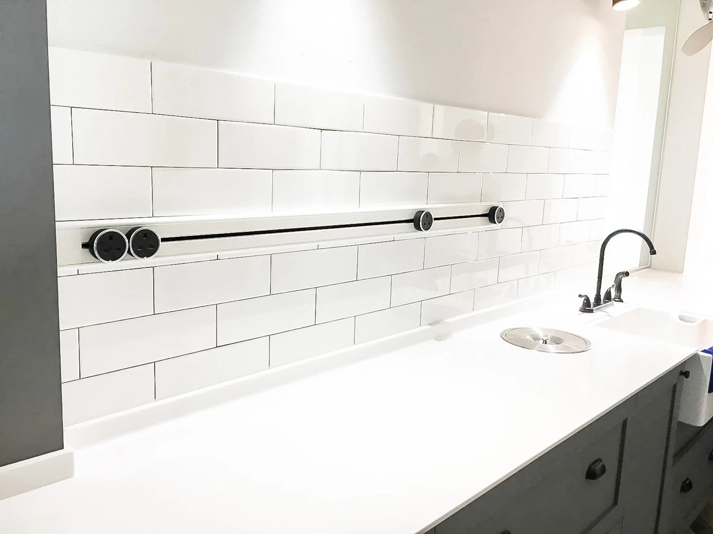 Line8 Model SL track in Black Hairline above a kitchen sink