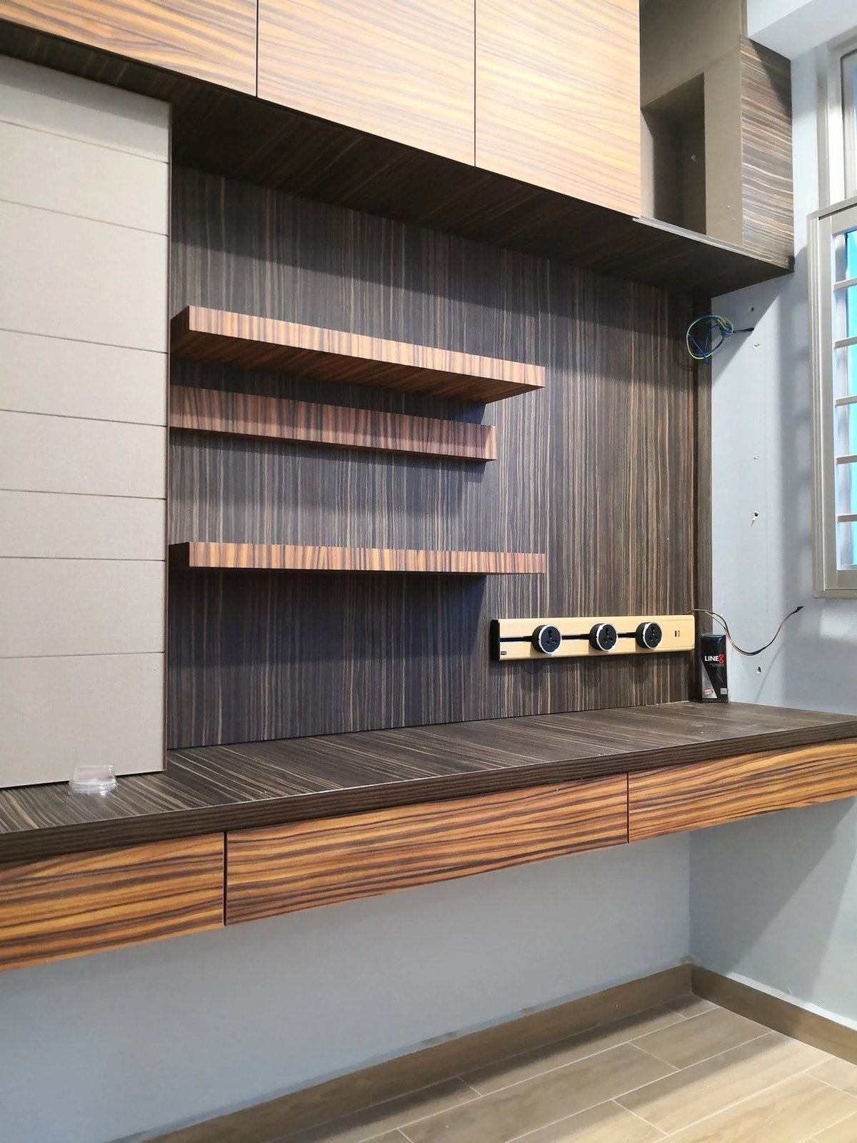 Line8 Model SL track in Burmese Teak mounted above a study desk with shelves