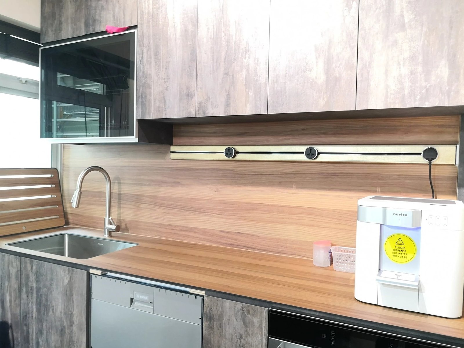 Line8 Model SL track in Silver Hairline above the kitchen sink powering appliances