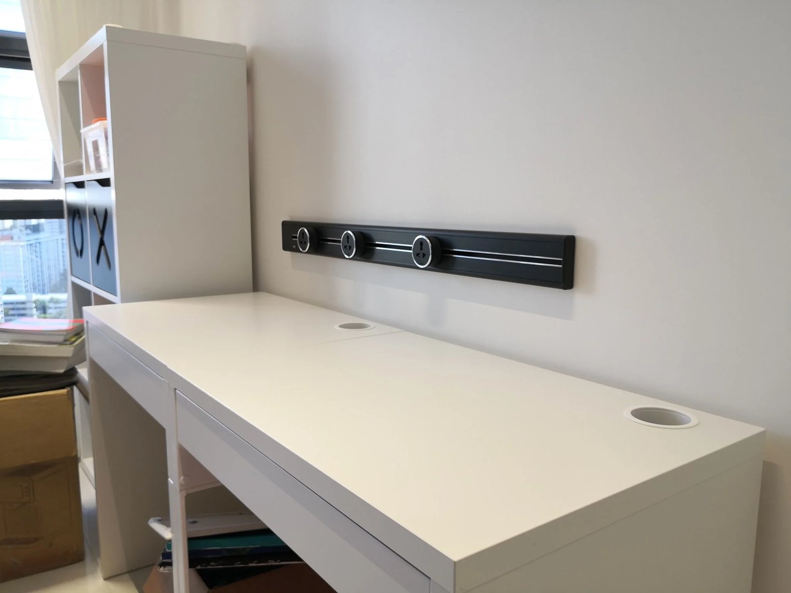 Line8 Model SL track in Black Hairline above a study desk powering lighting and devices
