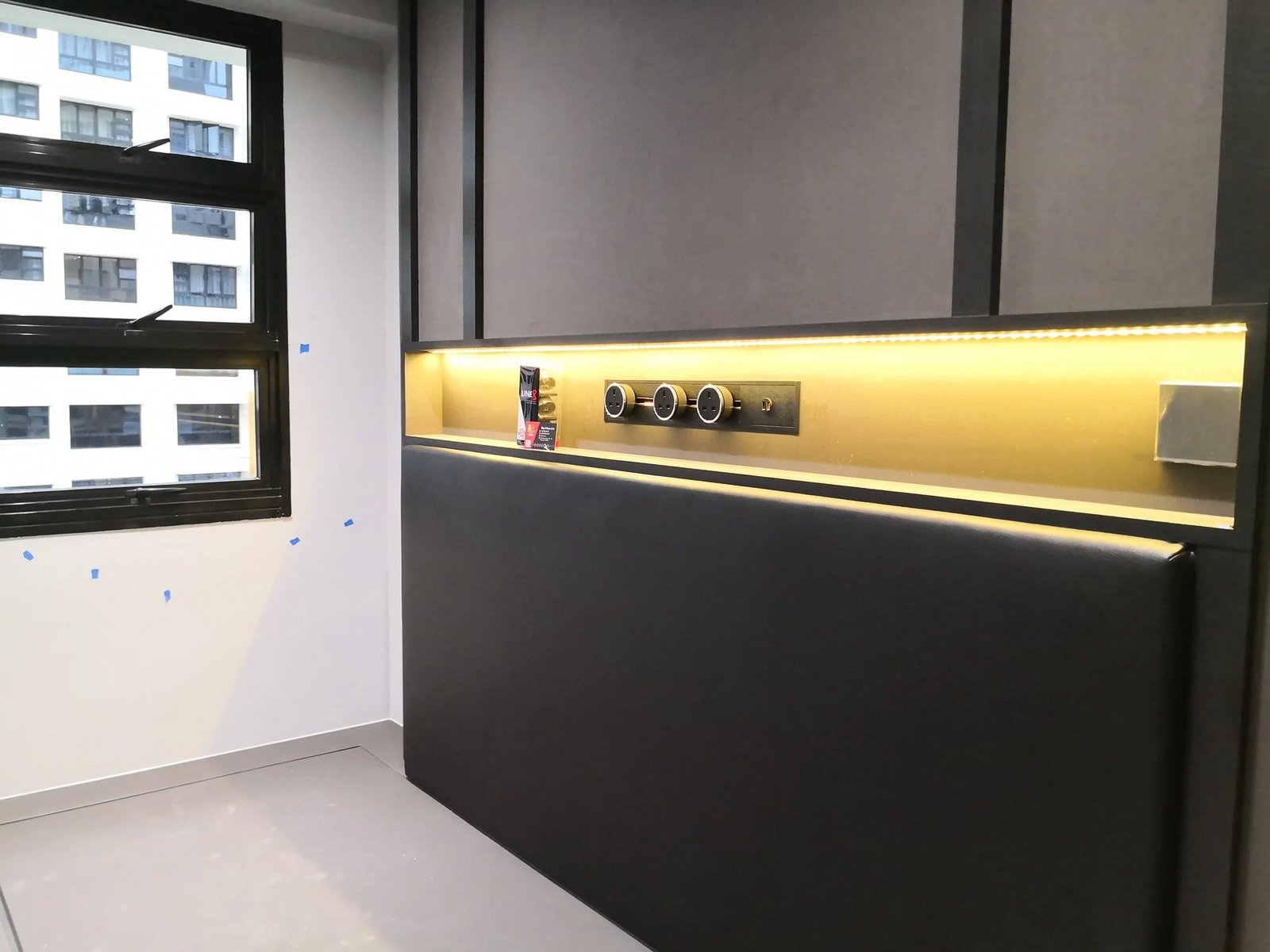 Line8 Model SL track in Black Hairline above a wall-mounted cabinet