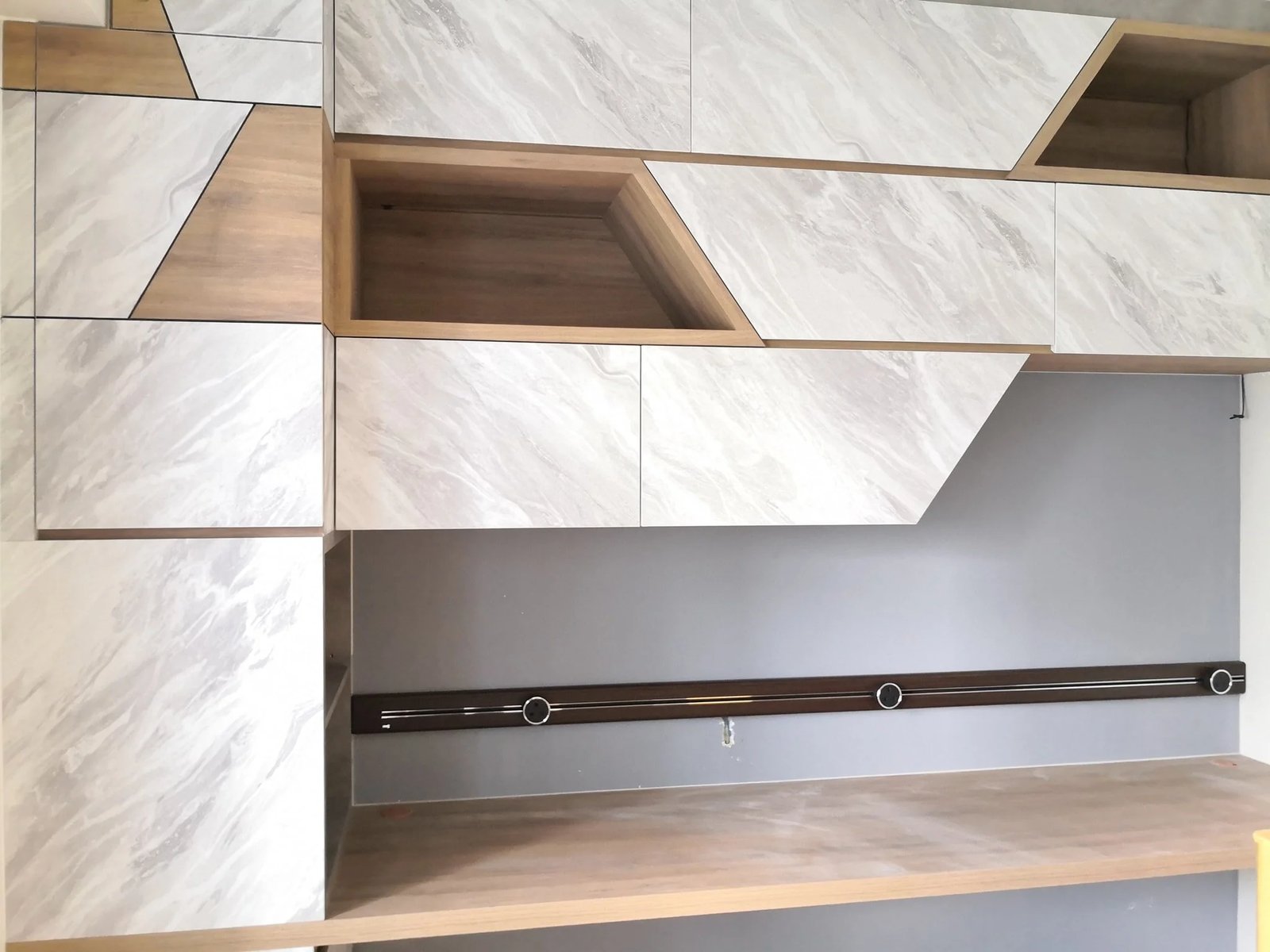Line8 Model SL track in Black Hairline above a study desk with cabinetry