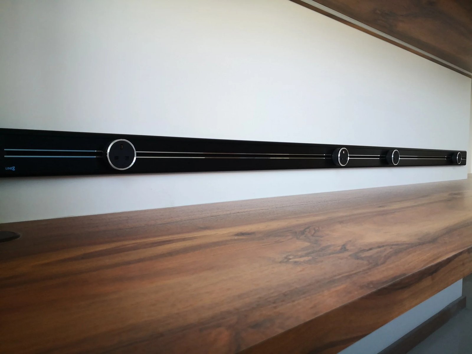 Line8 Model SL track in Black Hairline above a wooden desk