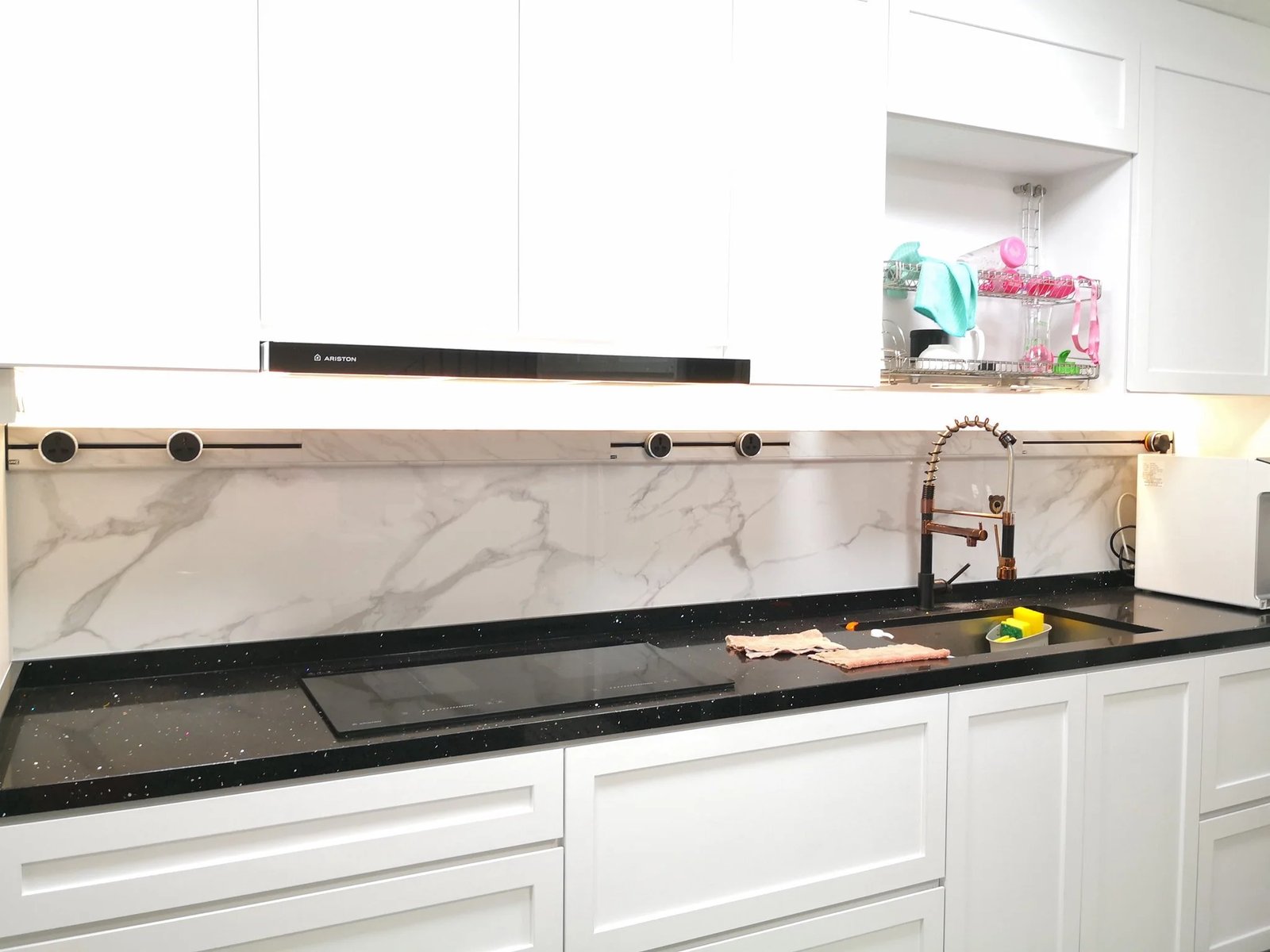 Line8 Model SL track in Black Hairline above the kitchen sink, powering lighting