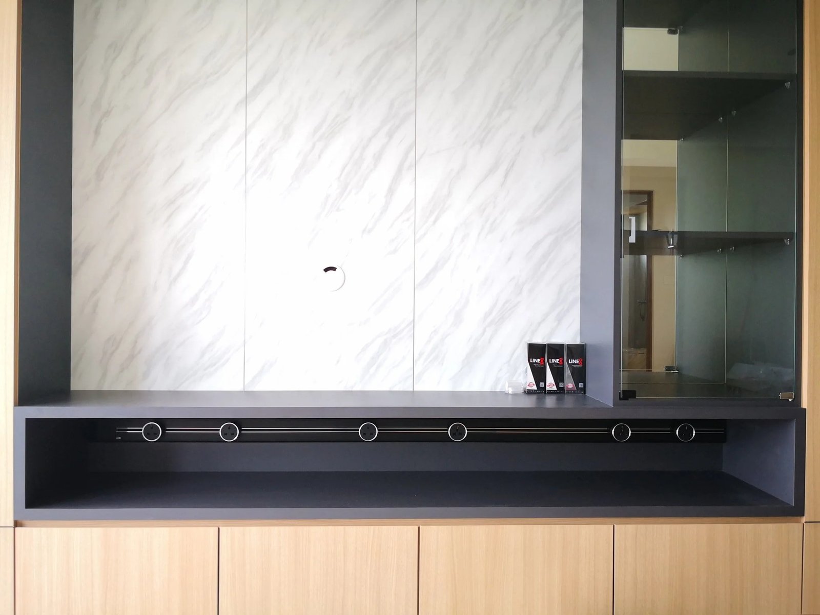 Line8 Model SL track in Black Hairline above a display cabinet