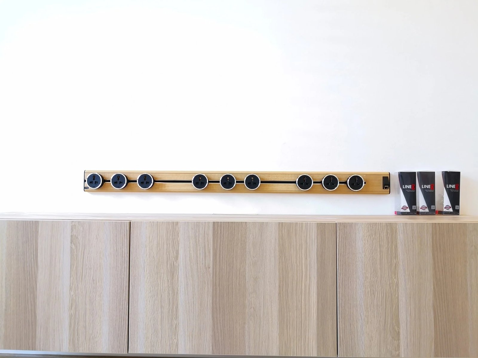 Line8 Model SL track in American Spruce above a wooden cabinet