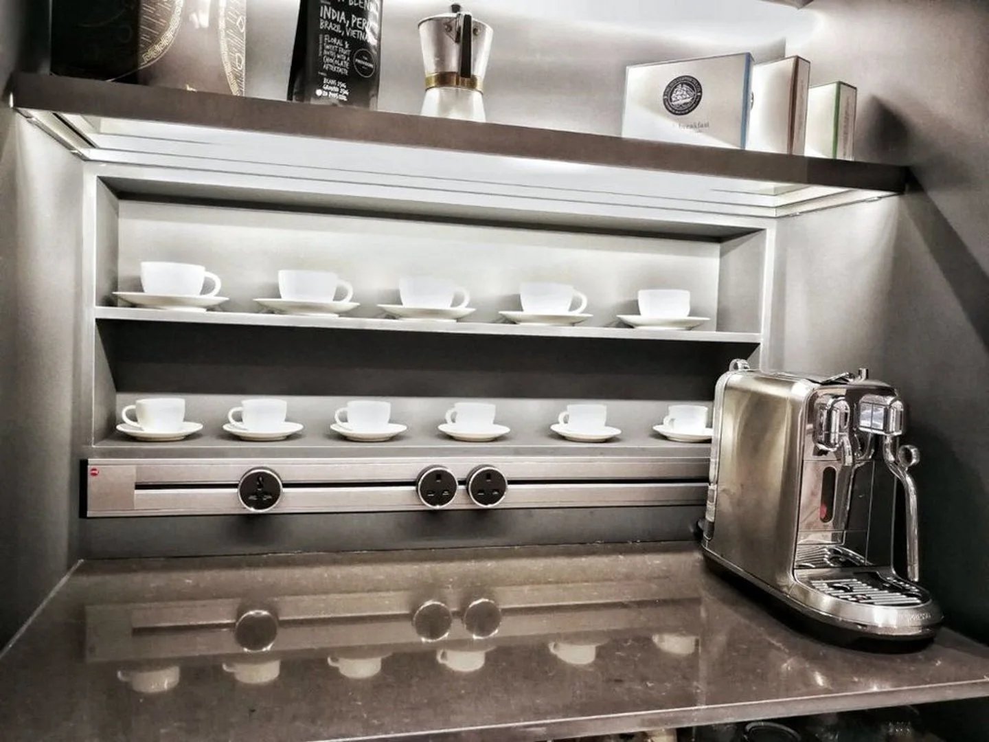 Line8 Model SL track in Silver Hairline above a coffee machine and cups on a shelf