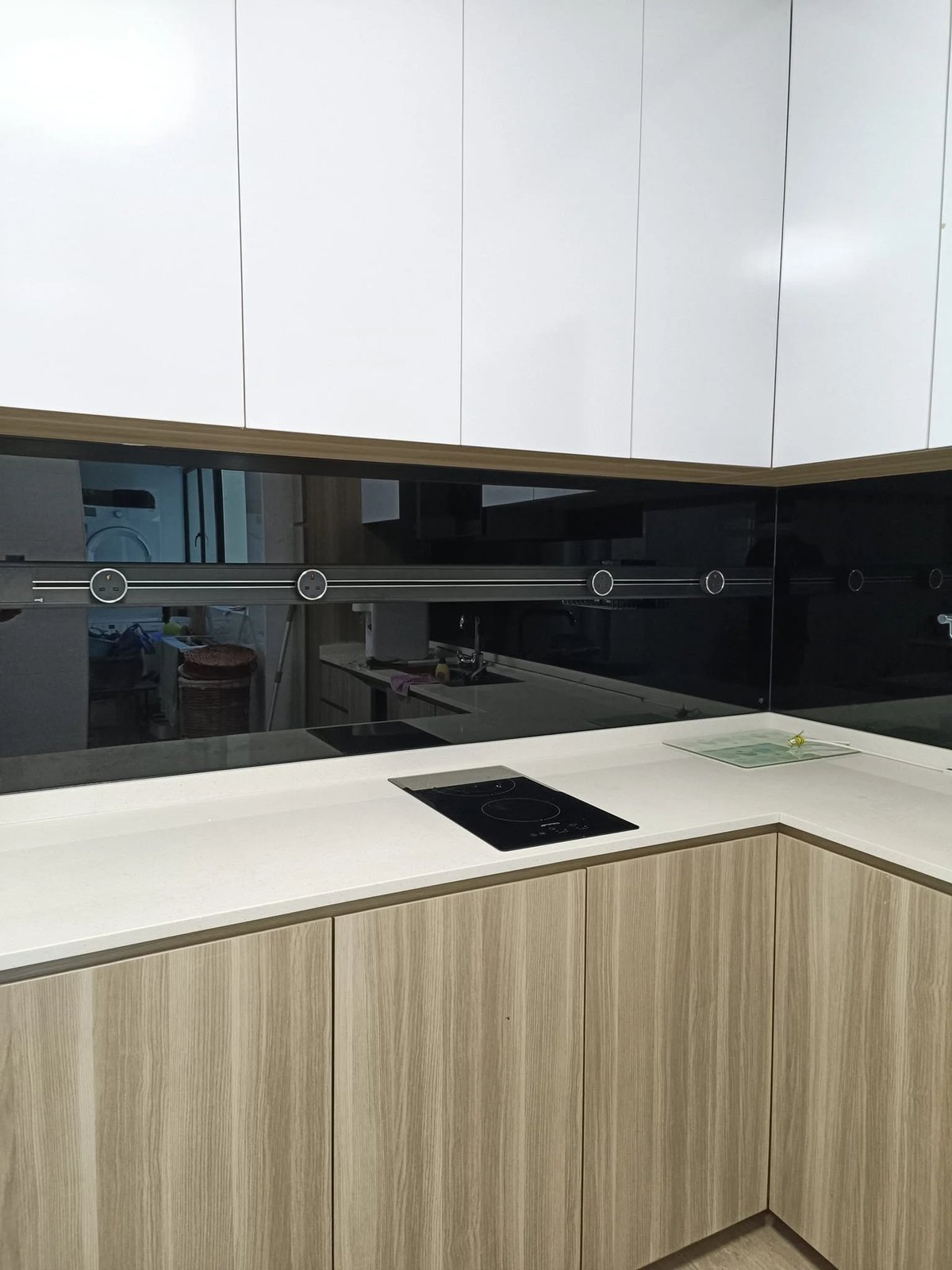 Line8 Model SL track in Black Hairline above the kitchen hob