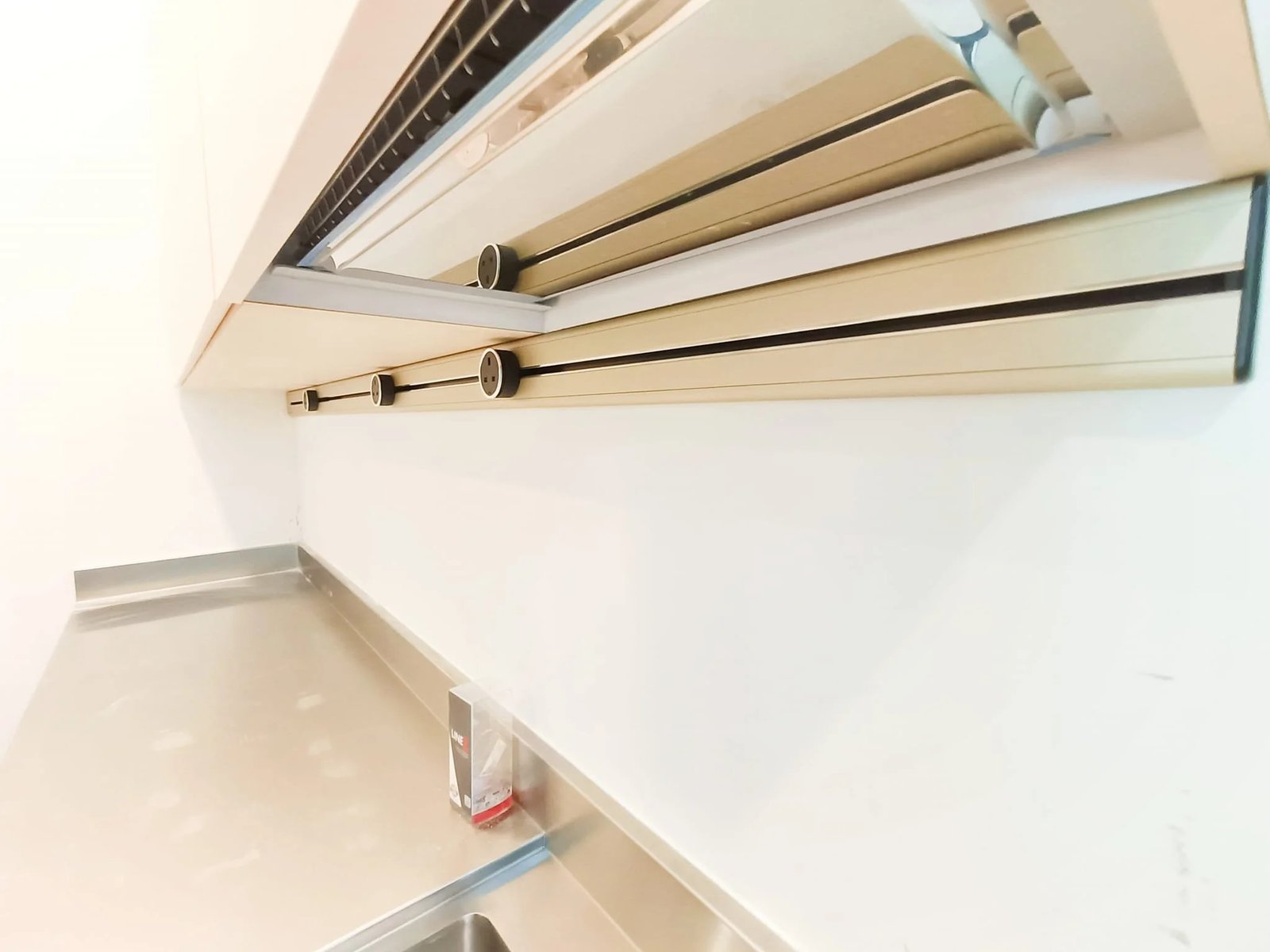 Line8 Model SL track in Champagne Gold above a kitchen sink