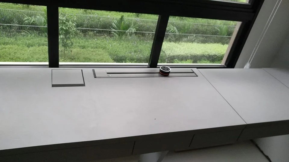 Line8 Model SL track in Black Hairline on a study desk near a window