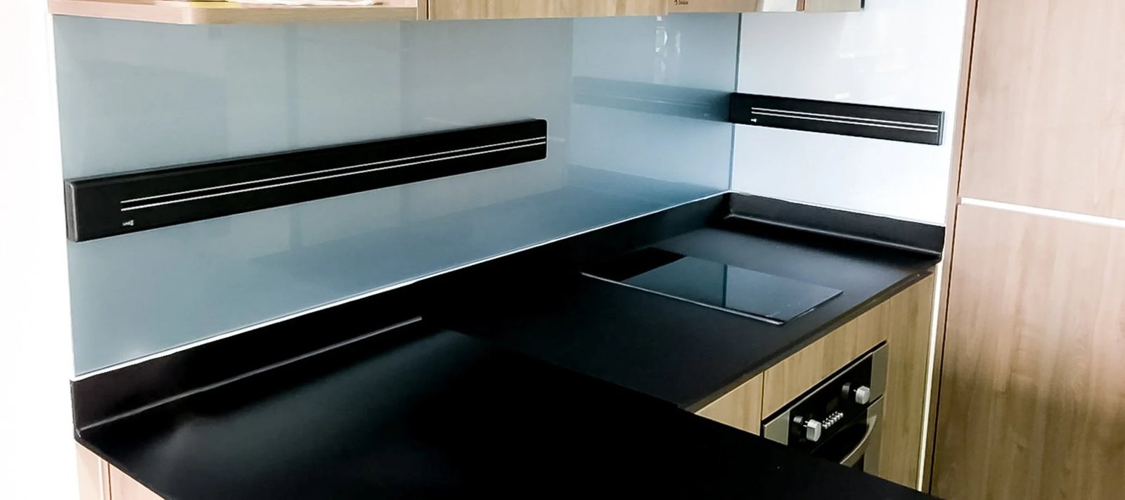 Line8 Model SL track in Black Hairline above the kitchen hob
