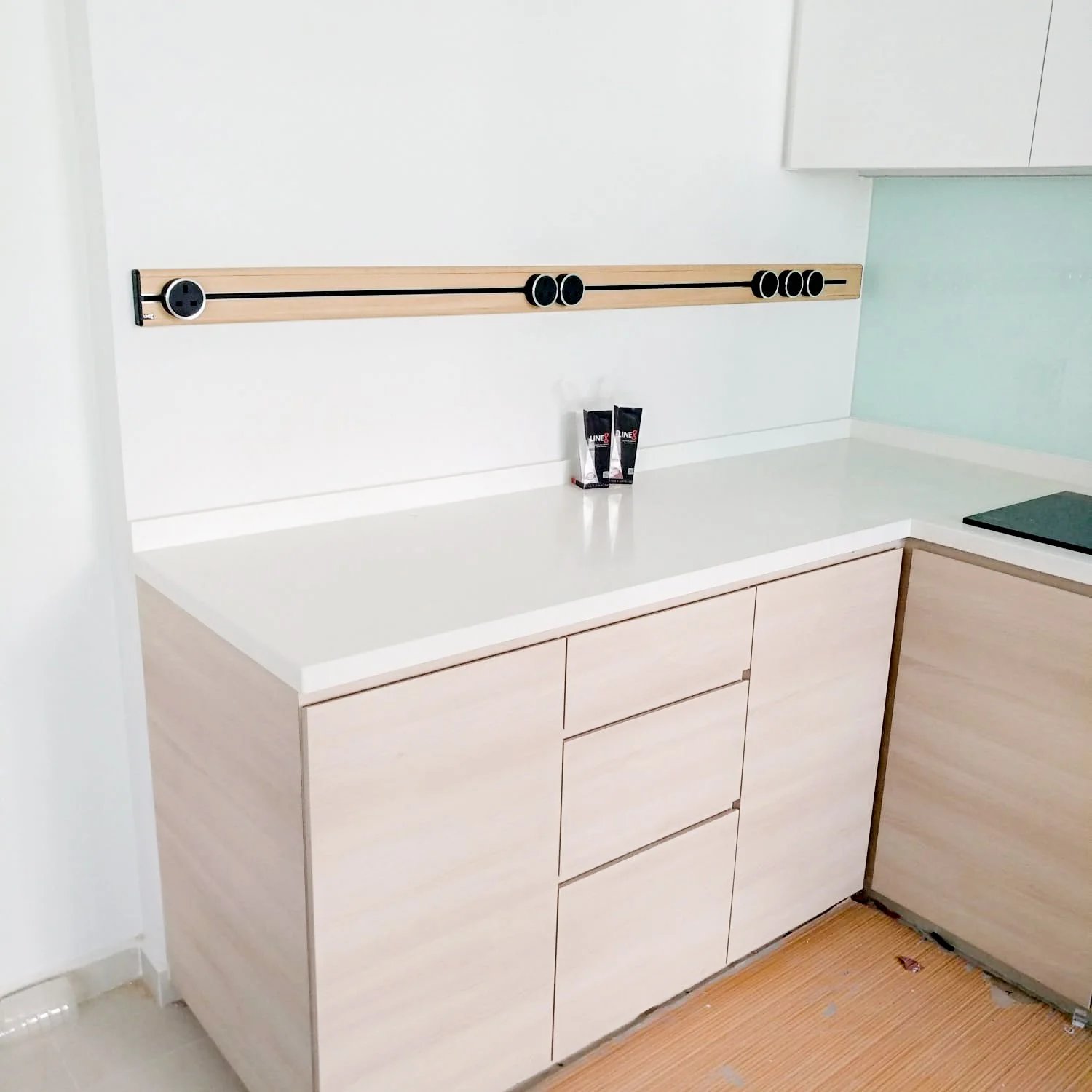 Line8 Model SL track in American Spruce above a kitchen countertop