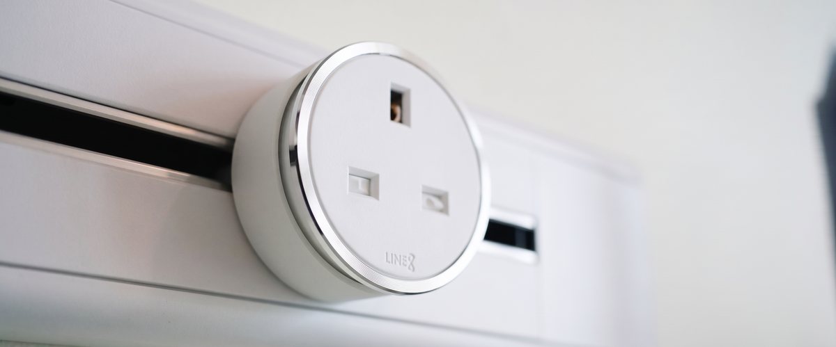 Macro shot of a white Line8 UKS-1 adaptor with visible LINE8 branding