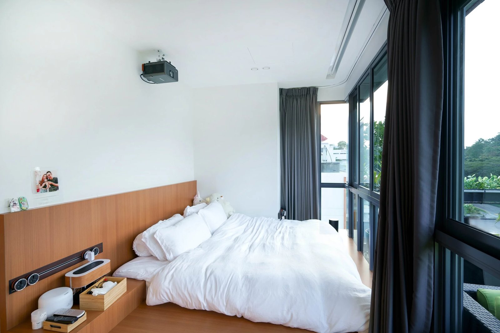 Line8 Model SL track in Black Hairline above the headboard in a bedroom
