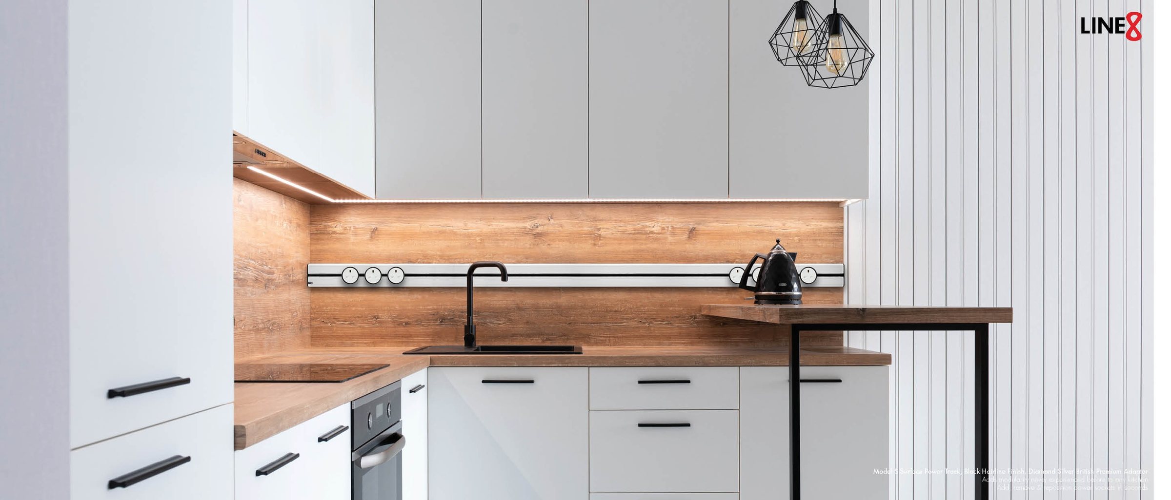 Line8 power track, Black Hairline finish, integrated into a modern kitchen backsplash