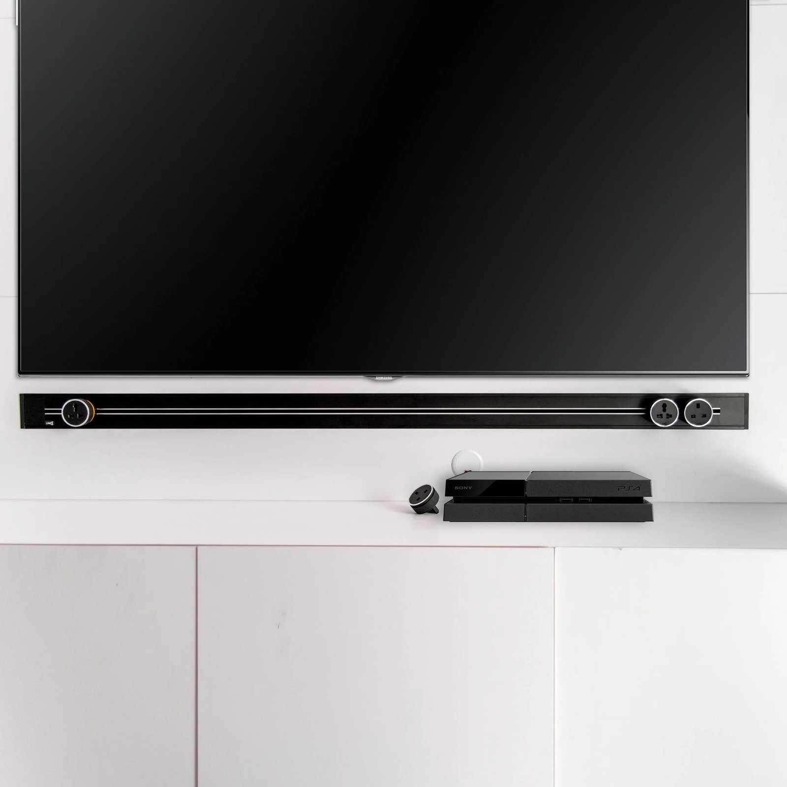 Line8 Model SL track in Black Hairline above a TV unit powering entertainment devices
