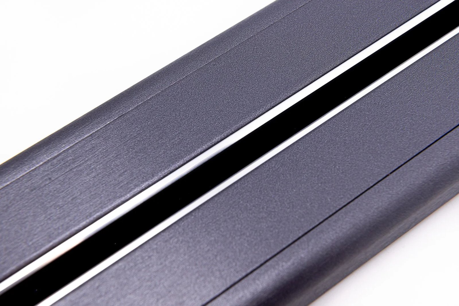 Line8 Model SL track in Black Hairline on a flat surface