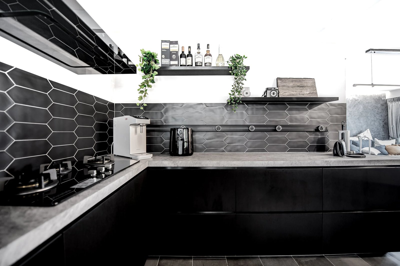 Line8 Model SL track in Black Hairline above the kitchen counter powering appliances