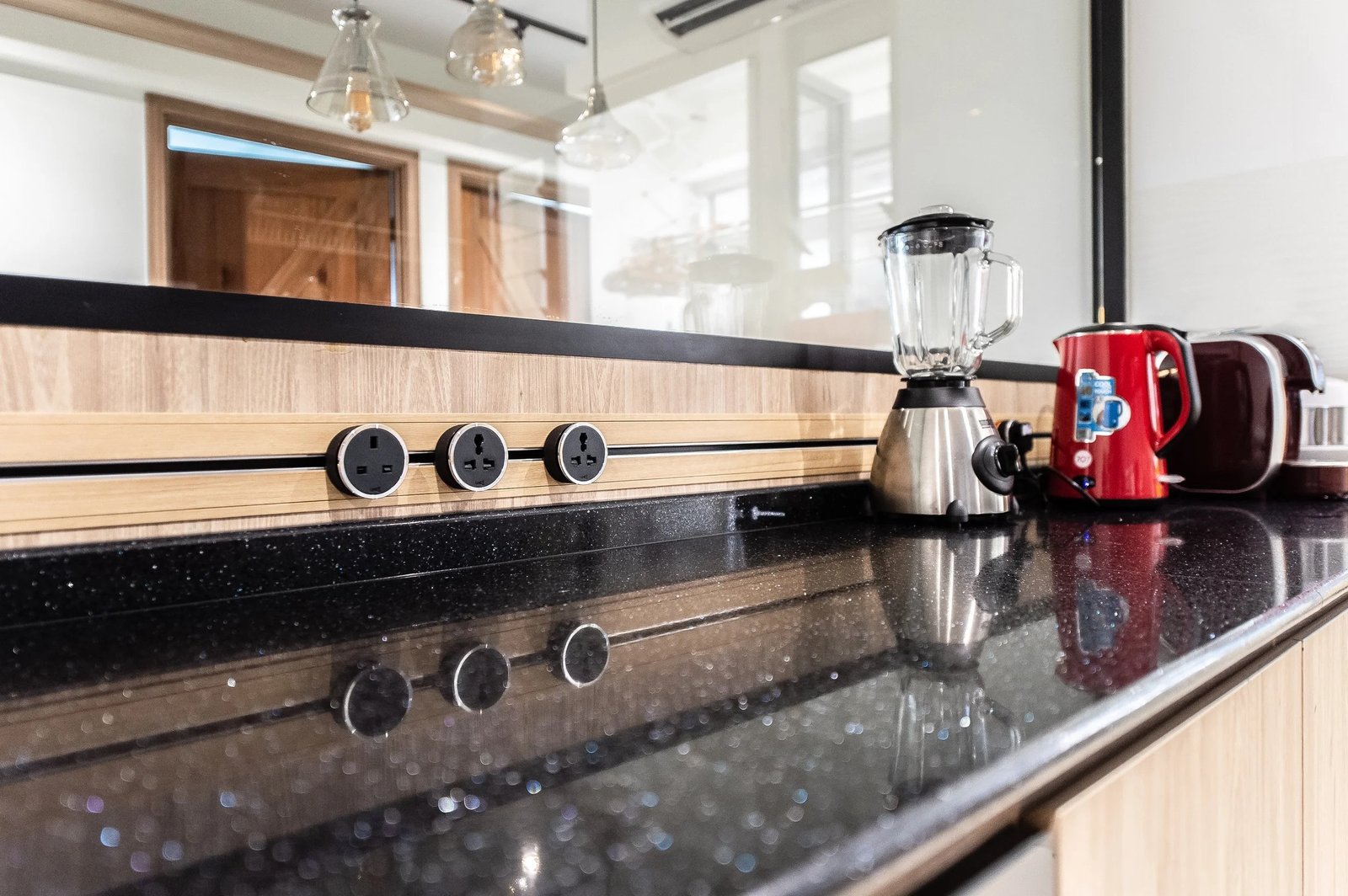Line8 Model SL track in Black Hairline along a kitchen countertop with appliances