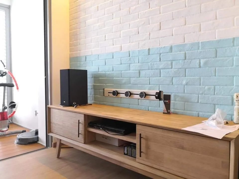 Line8 Model SL track in Silver Hairline mounted above a wooden TV console