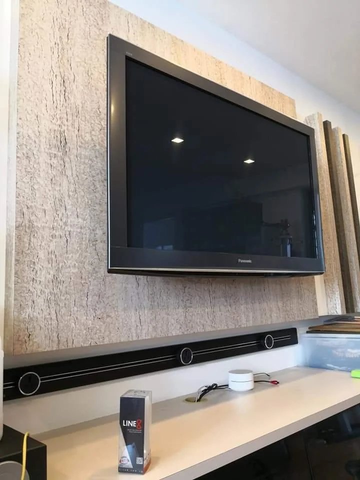 Line8 Model SL track in Black Hairline below a television in a living room