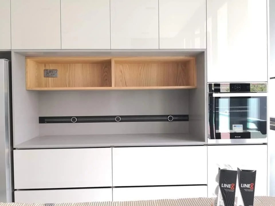 Line8 Model SL track in Black Hairline above a kitchen countertop with appliances