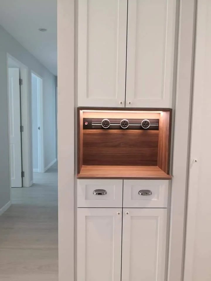 Line8 Model SL track in Black Hairline above a wooden shelf in a living area