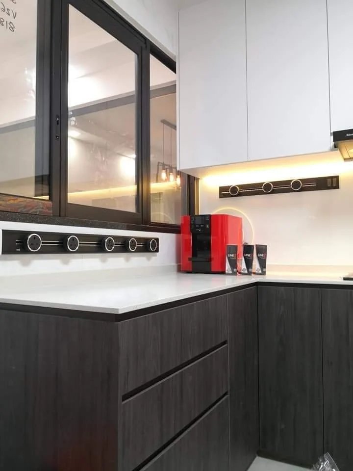 Line8 Model SL track in Black Hairline above a kitchen countertop with coffee machine and accessories