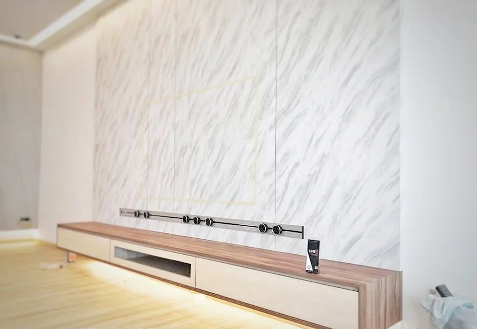 Line8 Model SL track in Silver Hairline mounted above a wooden media console