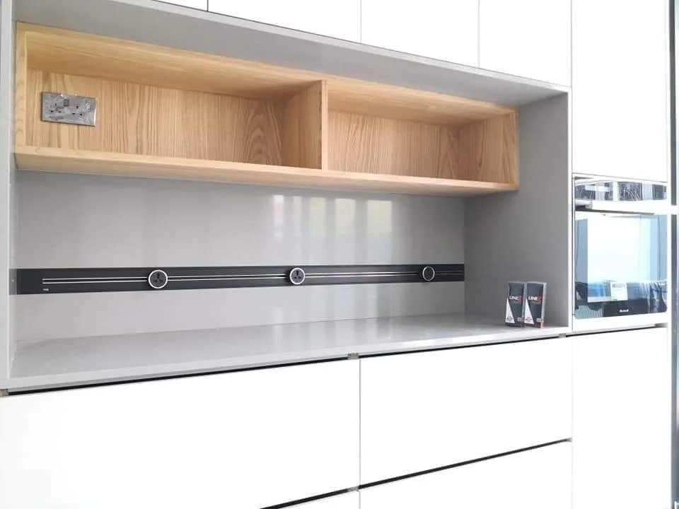 Line8 Model SL track in Black Hairline above a kitchen shelf powering appliances