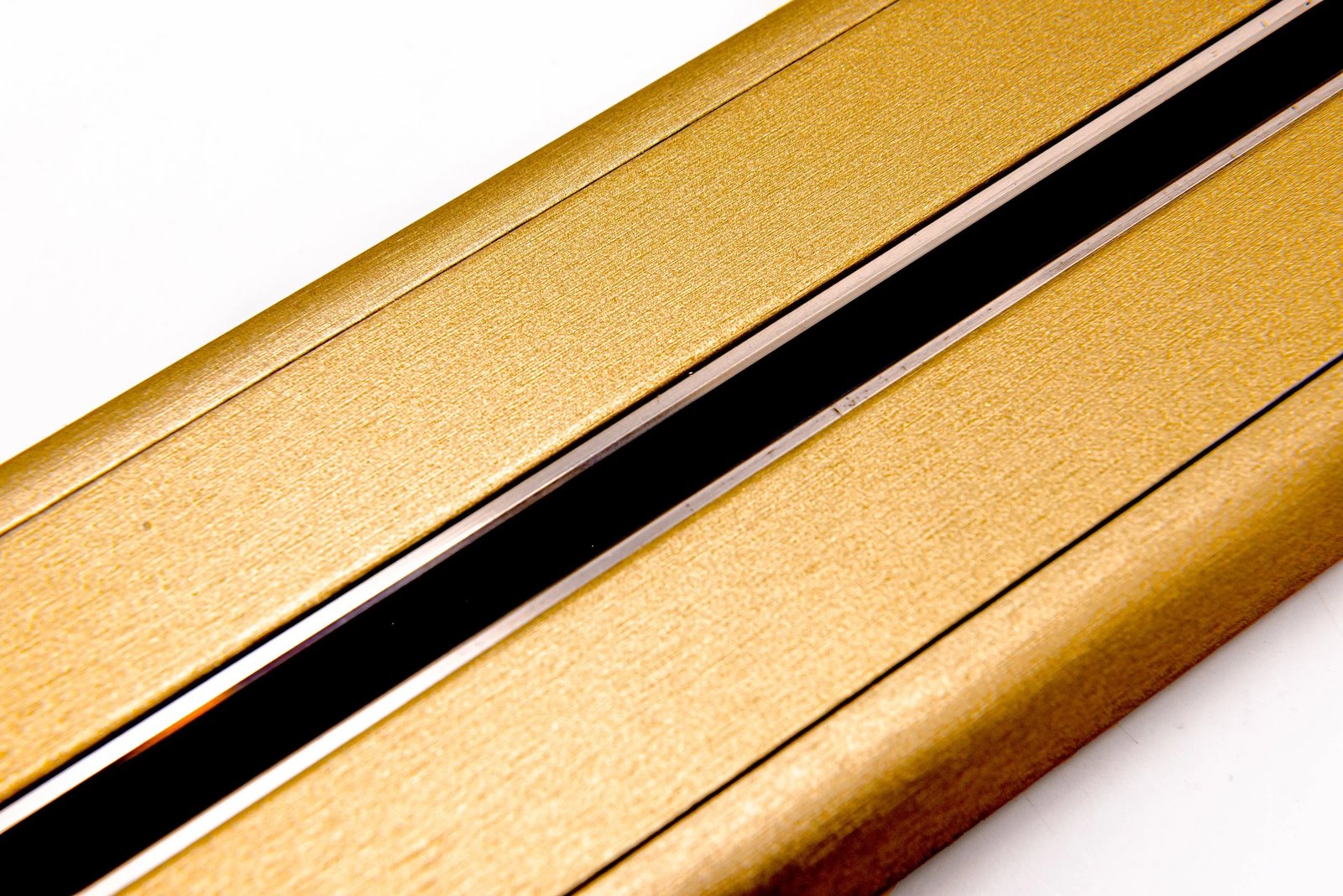 Line8 Model SL track in Gold Hairline on a plain background