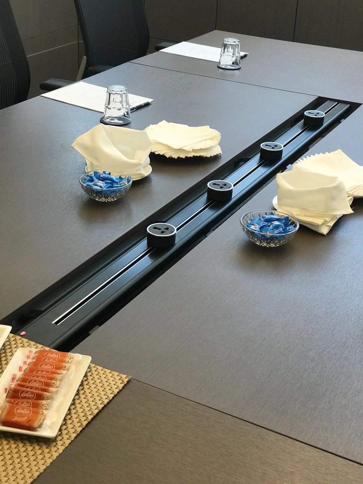 Line8 Model SL track in Black Hairline embedded in a conference room table