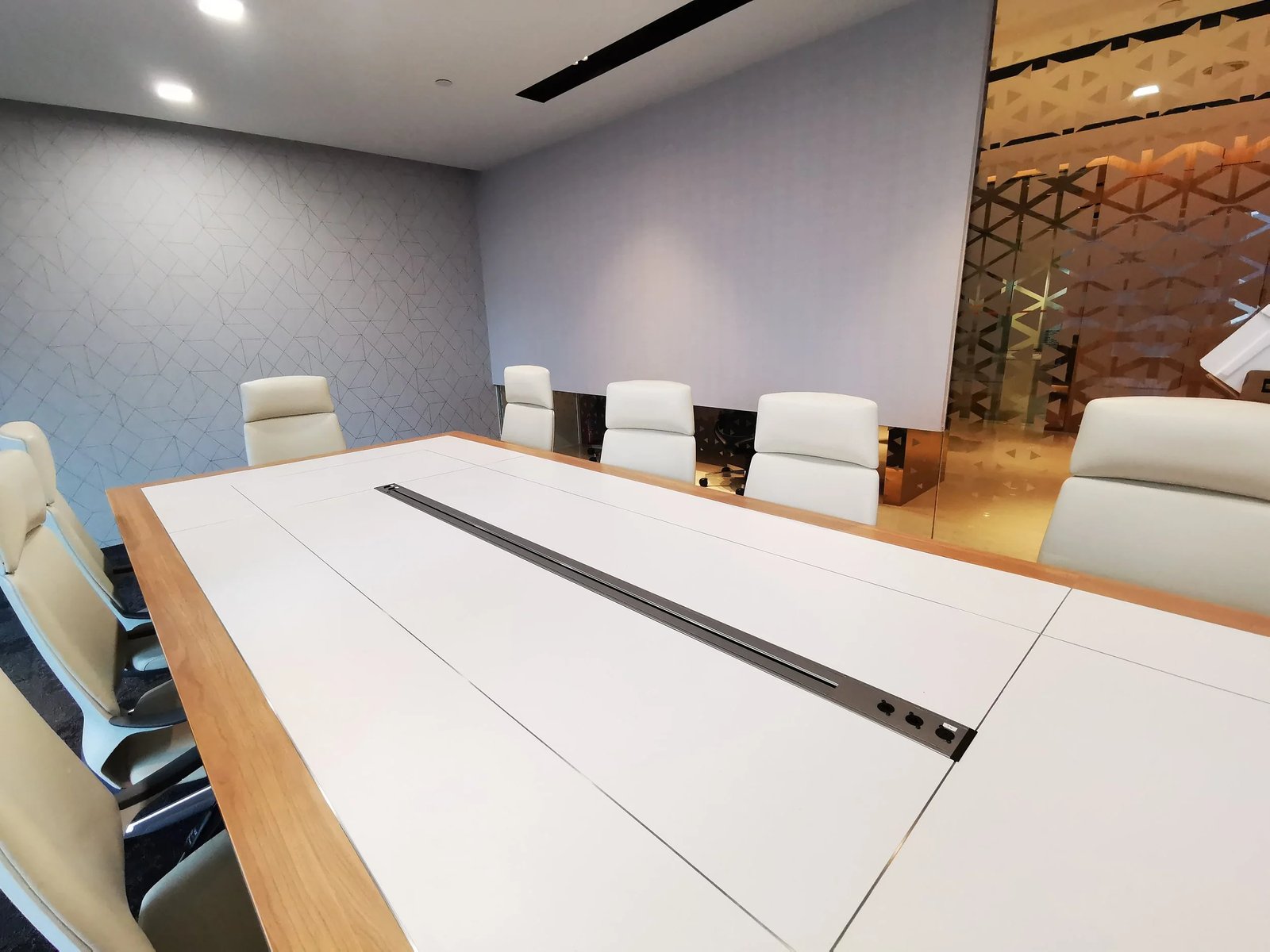 Line8 Model R track in Black Hairline recessed into a conference room table