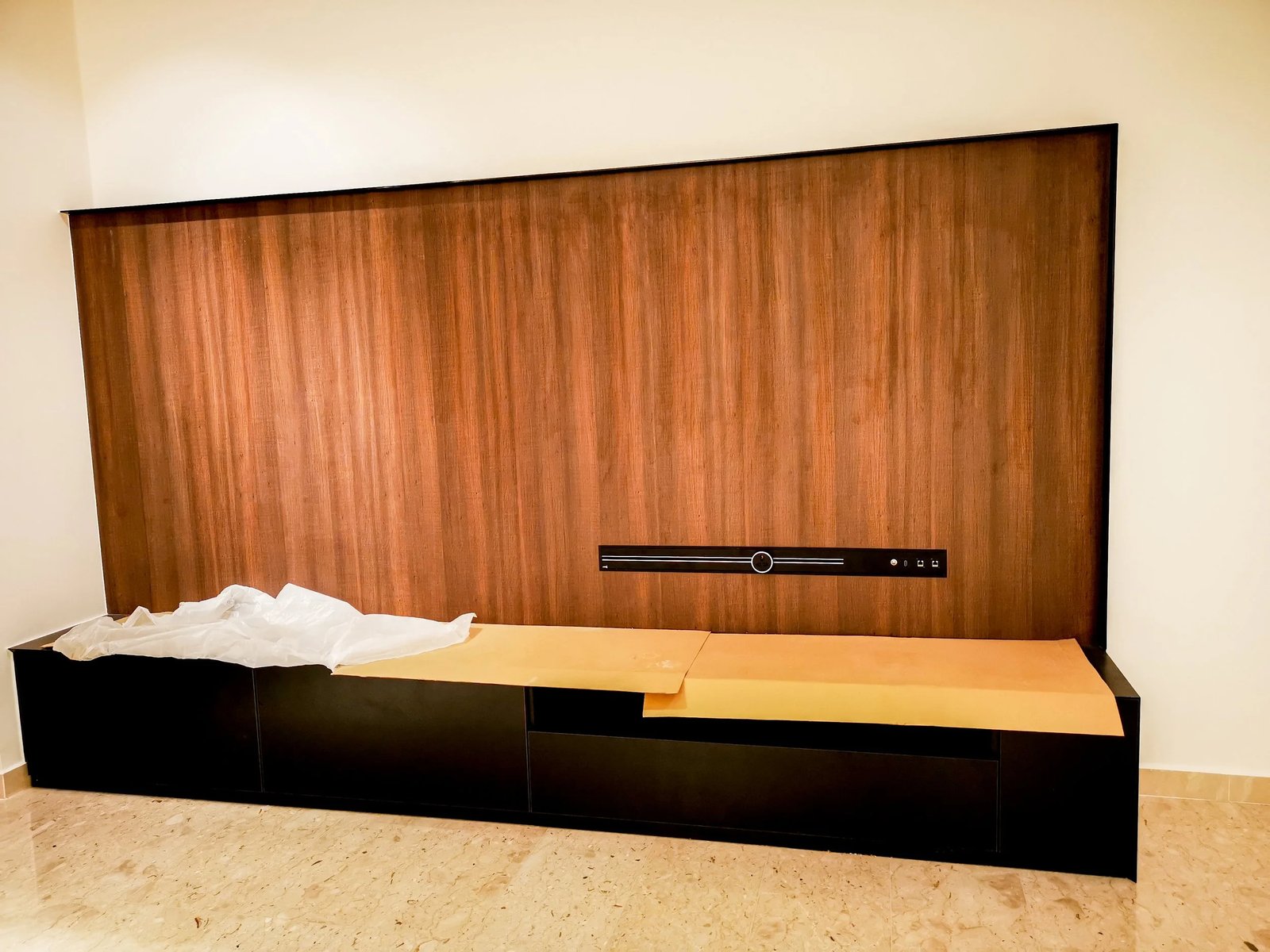 Line8 Model SL track in Burmese Teak above a low cabinet in a living room