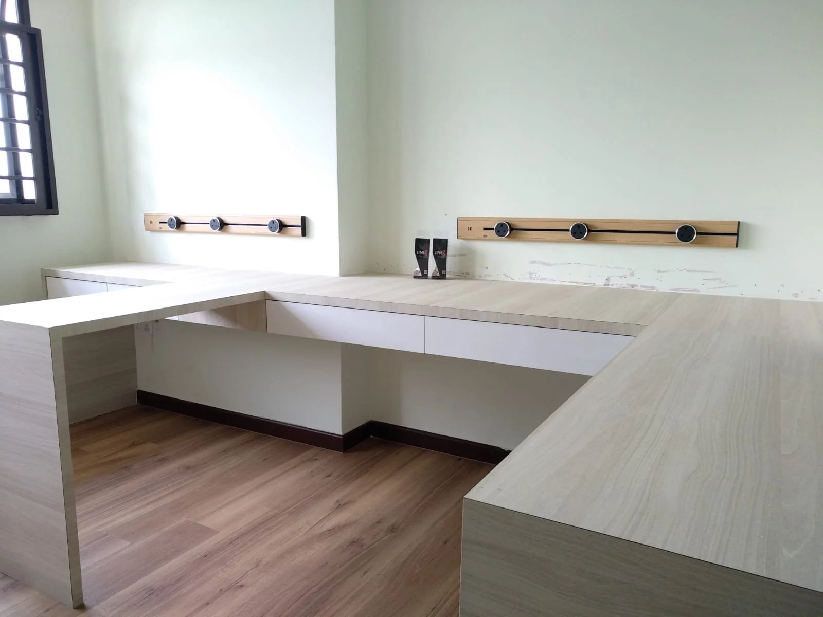 Line8 Model SL track in American Spruce above a study desk
