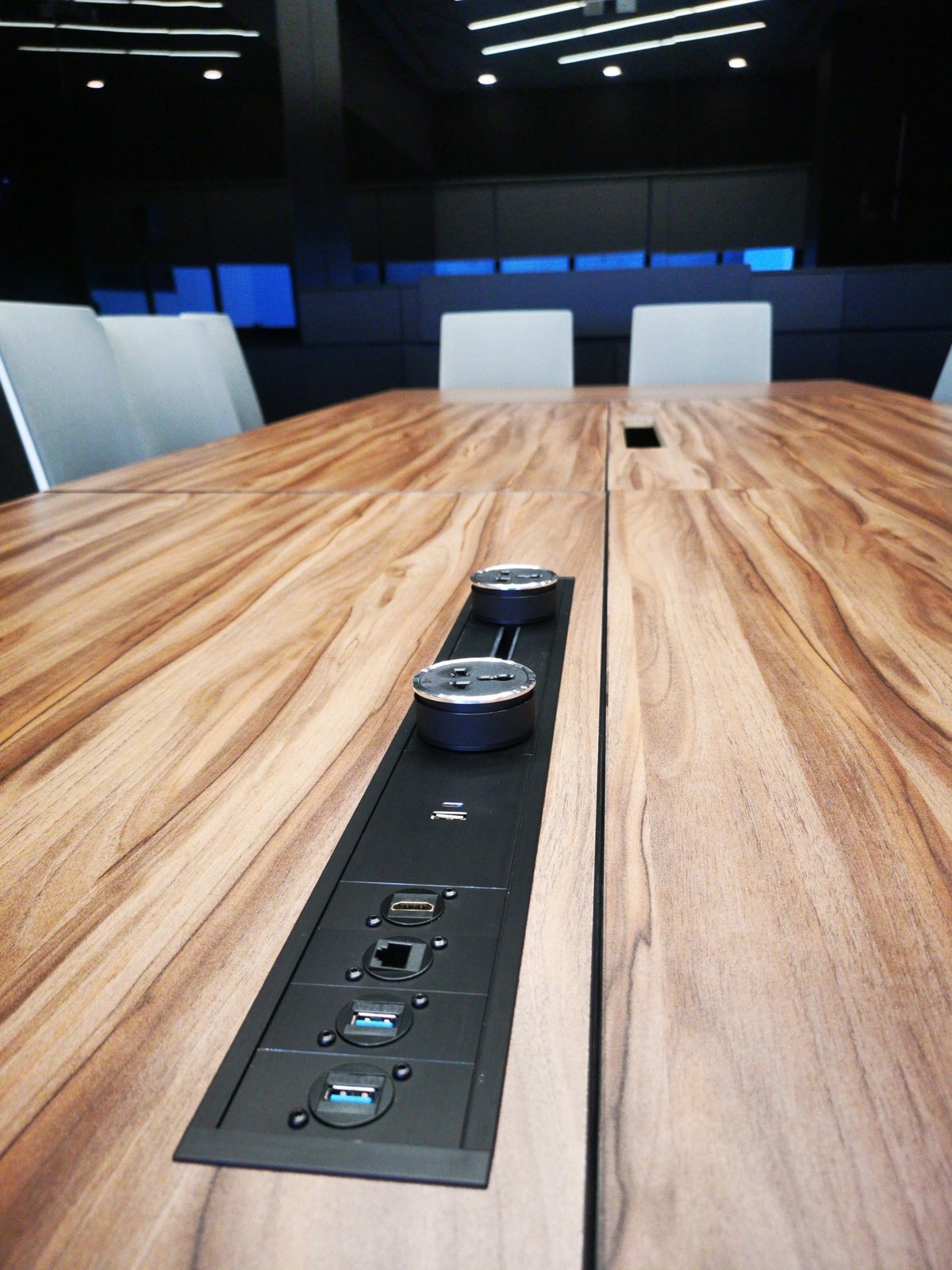 Line8 Model SL track in Black Hairline integrated into a conference table
