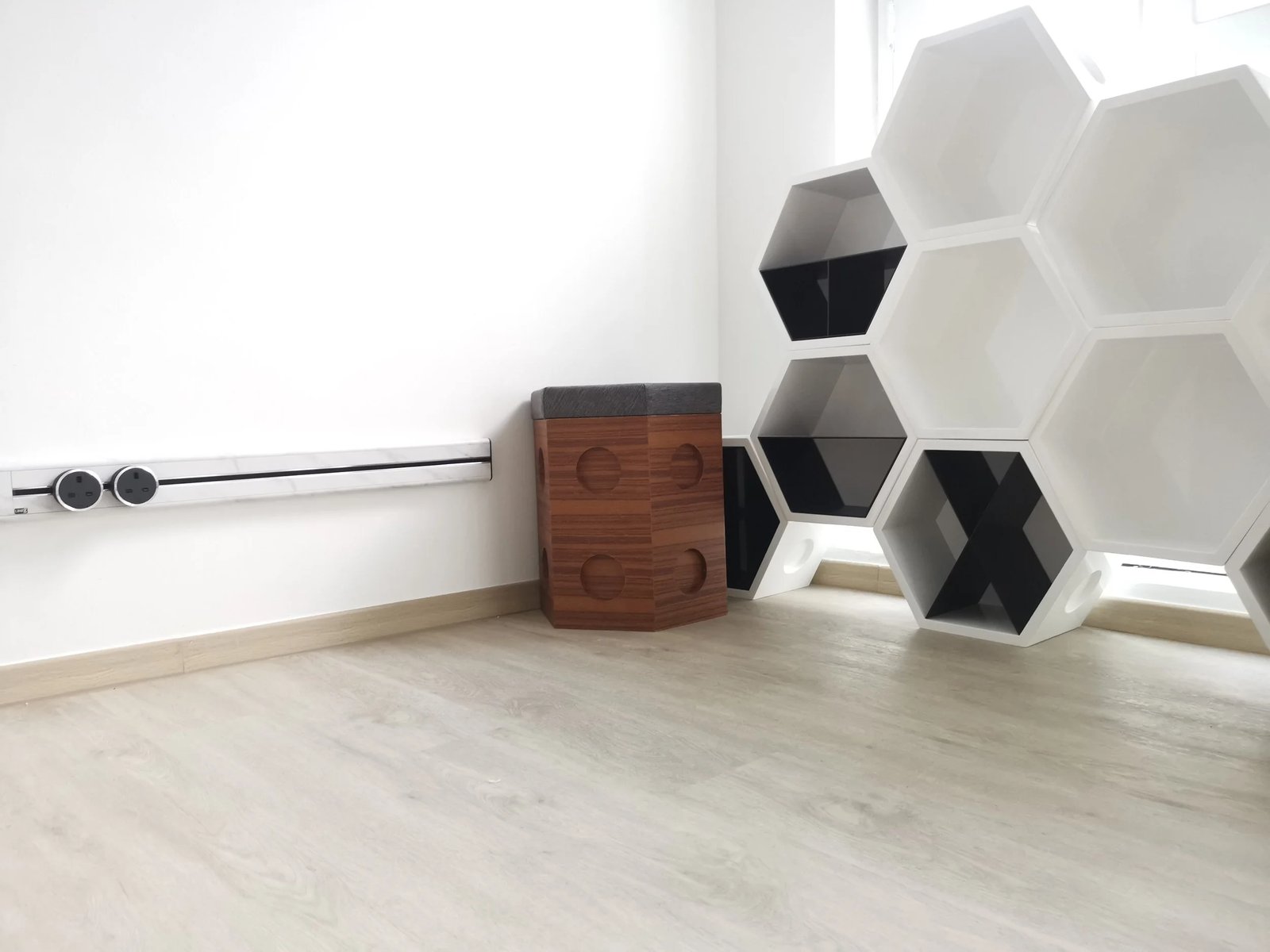 Line8 Model SL track in Silver Hairline along a bedroom wall powering a decorative shelf