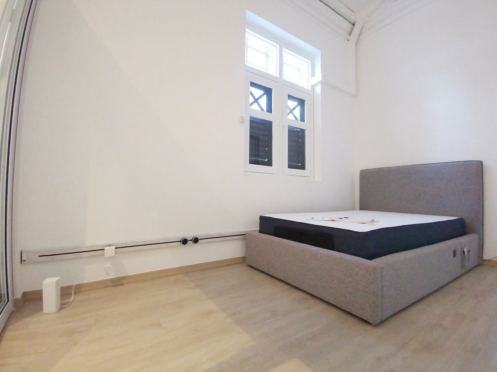 Line8 Model SL track in Black Hairline along the wall near the bed