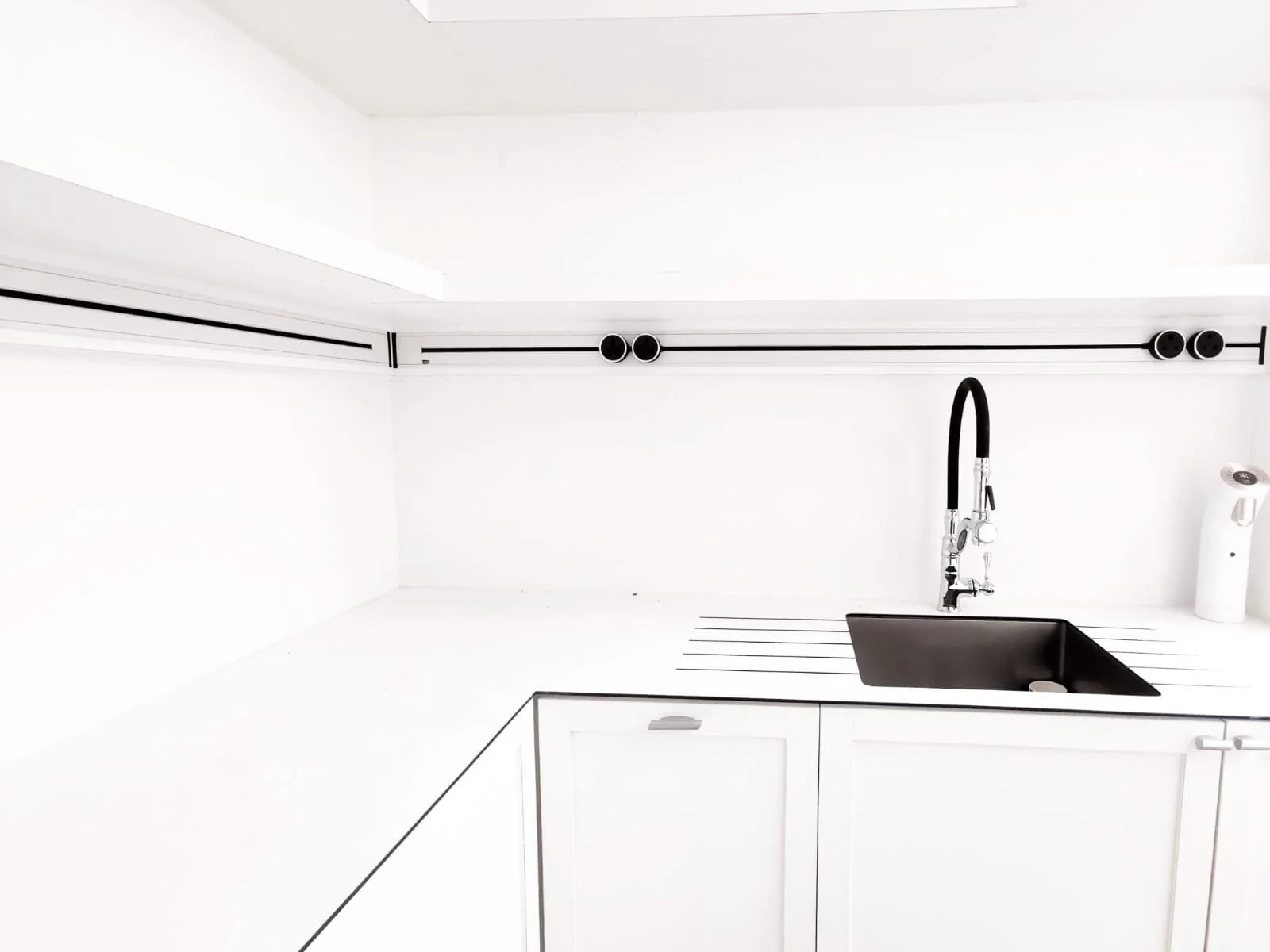 Line8 Model SL track in Black Hairline above a kitchen sink