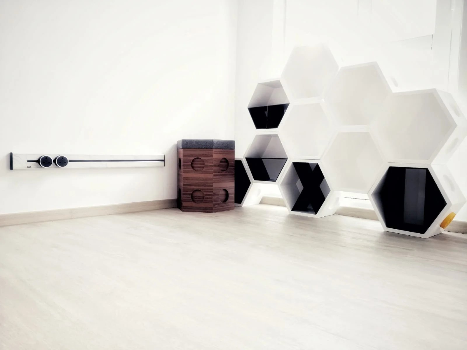 Line8 Model SL track in Black Hairline along a wall powering a unique shelving unit