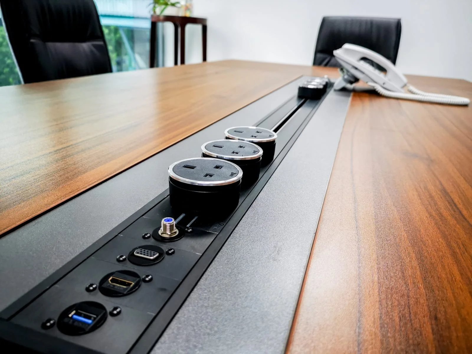 Line8 Model SL track in Black Hairline integrated into a conference room table