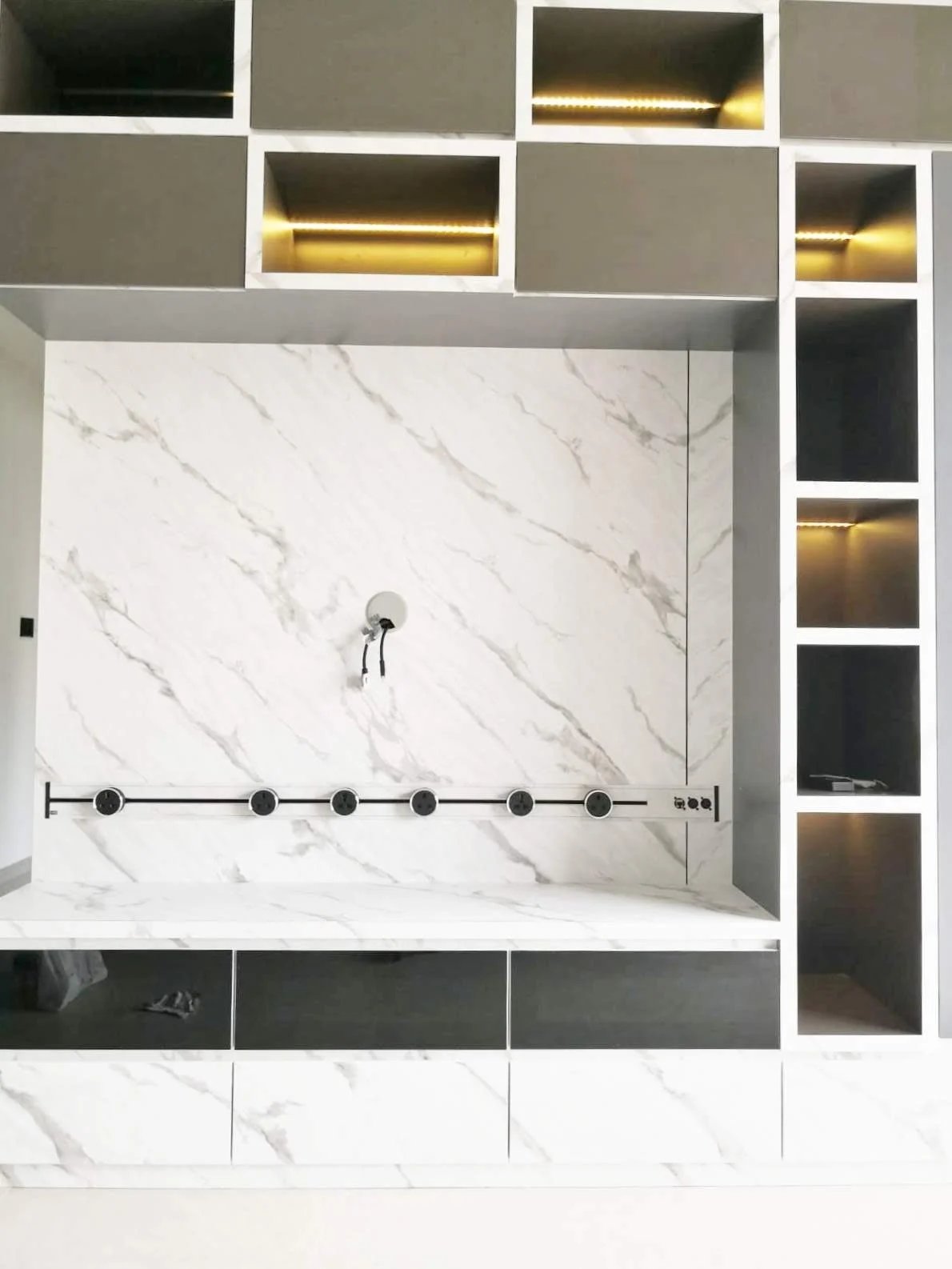 Line8 Model SL track in Black Hairline above a marble feature wall