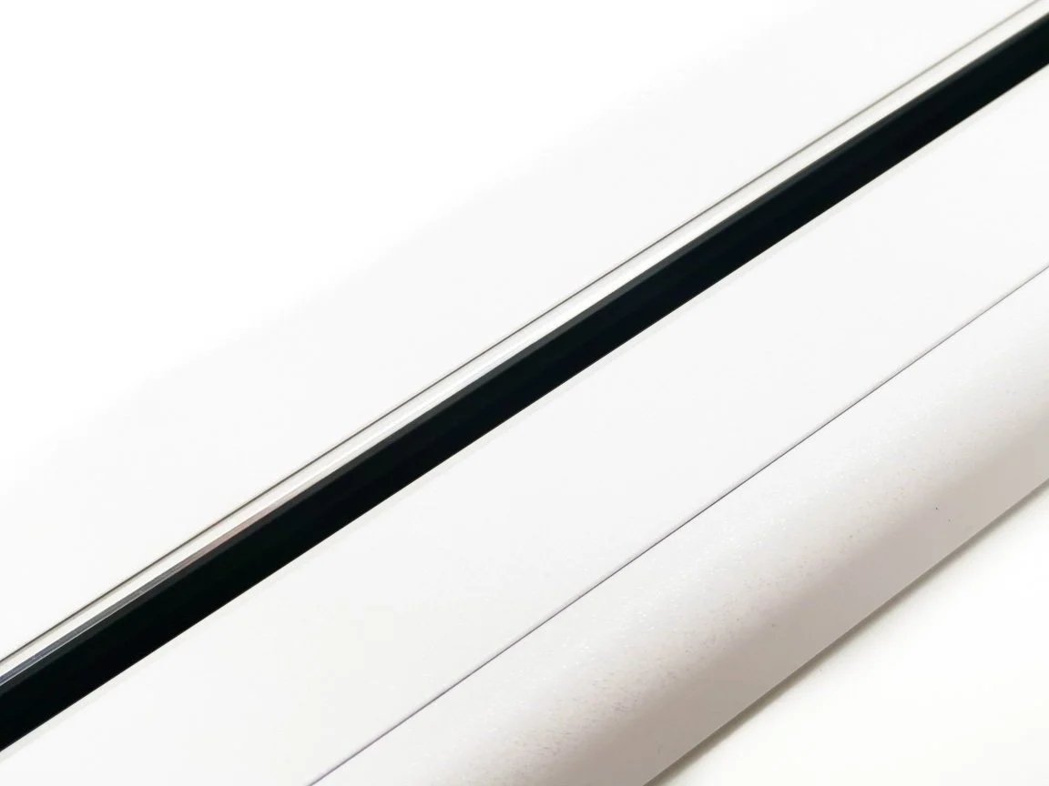 Line8 Model SL track in Black Hairline mounted on a white surface