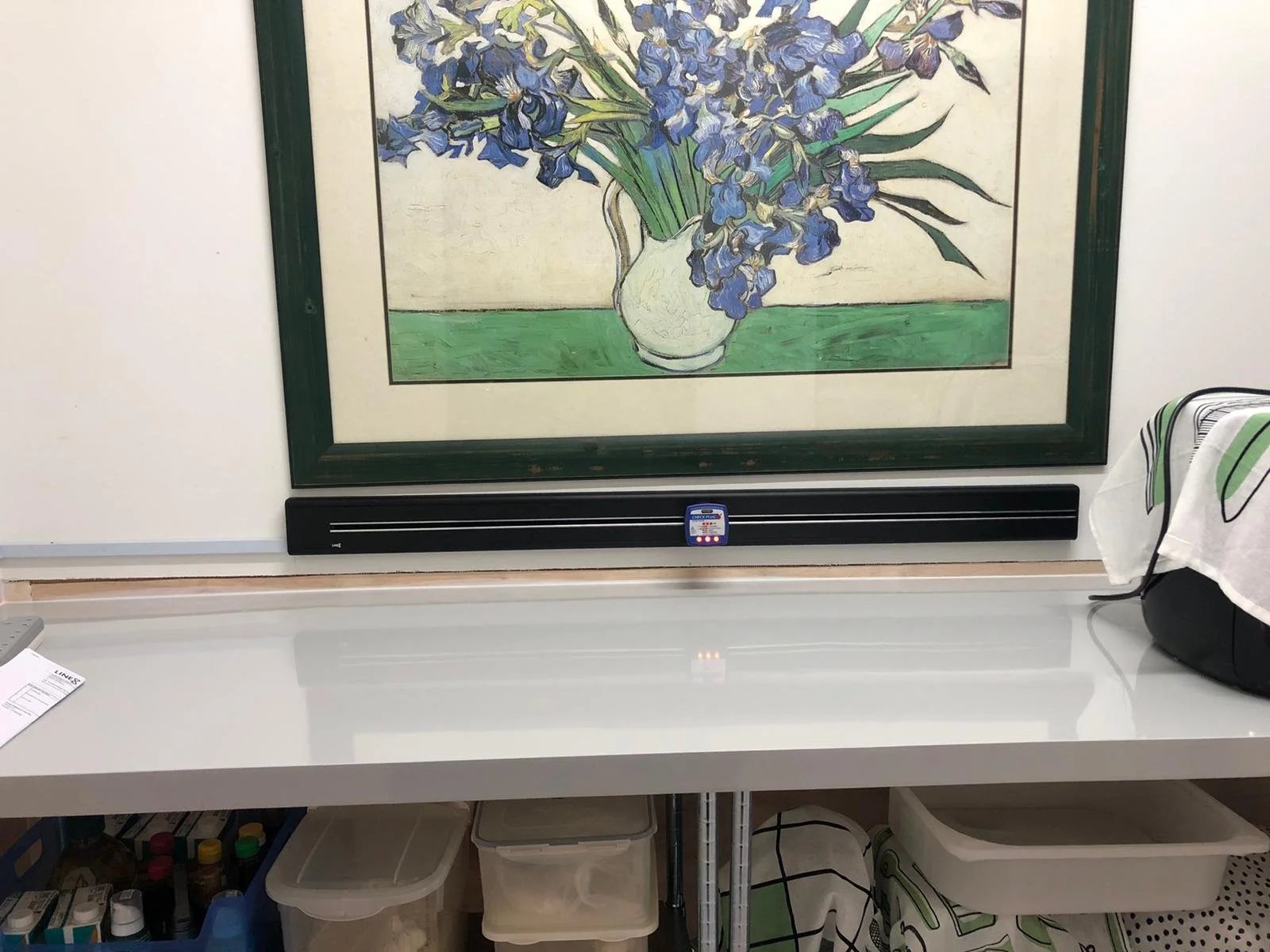 Line8 Model SL track in Black Hairline above a workbench with art and supplies