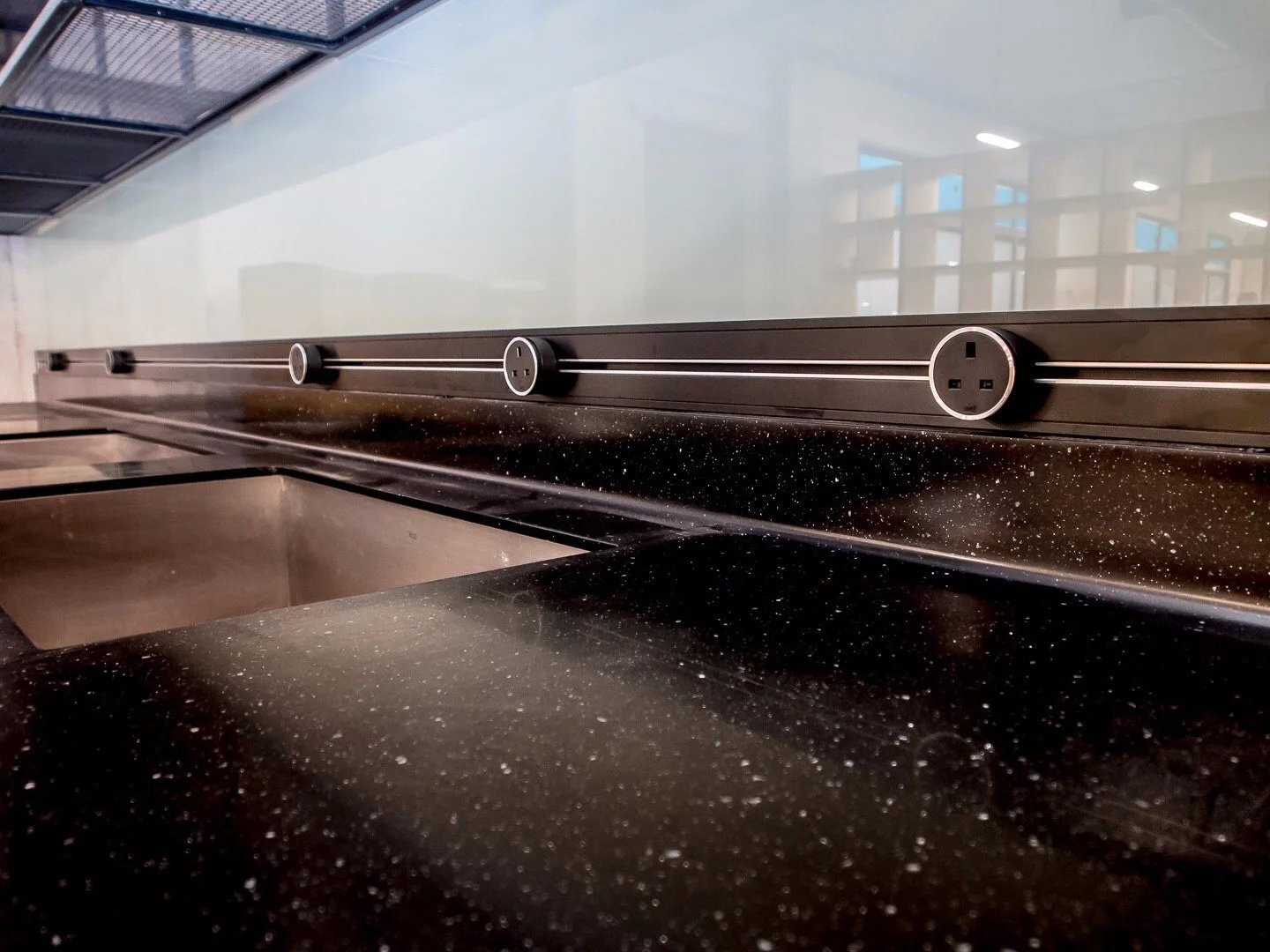Line8 Model SL track in Black Hairline above a kitchen sink