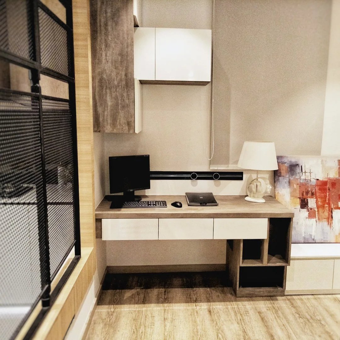 Line8 Model SL track in Black Hairline above a study desk powering a computer and lamp