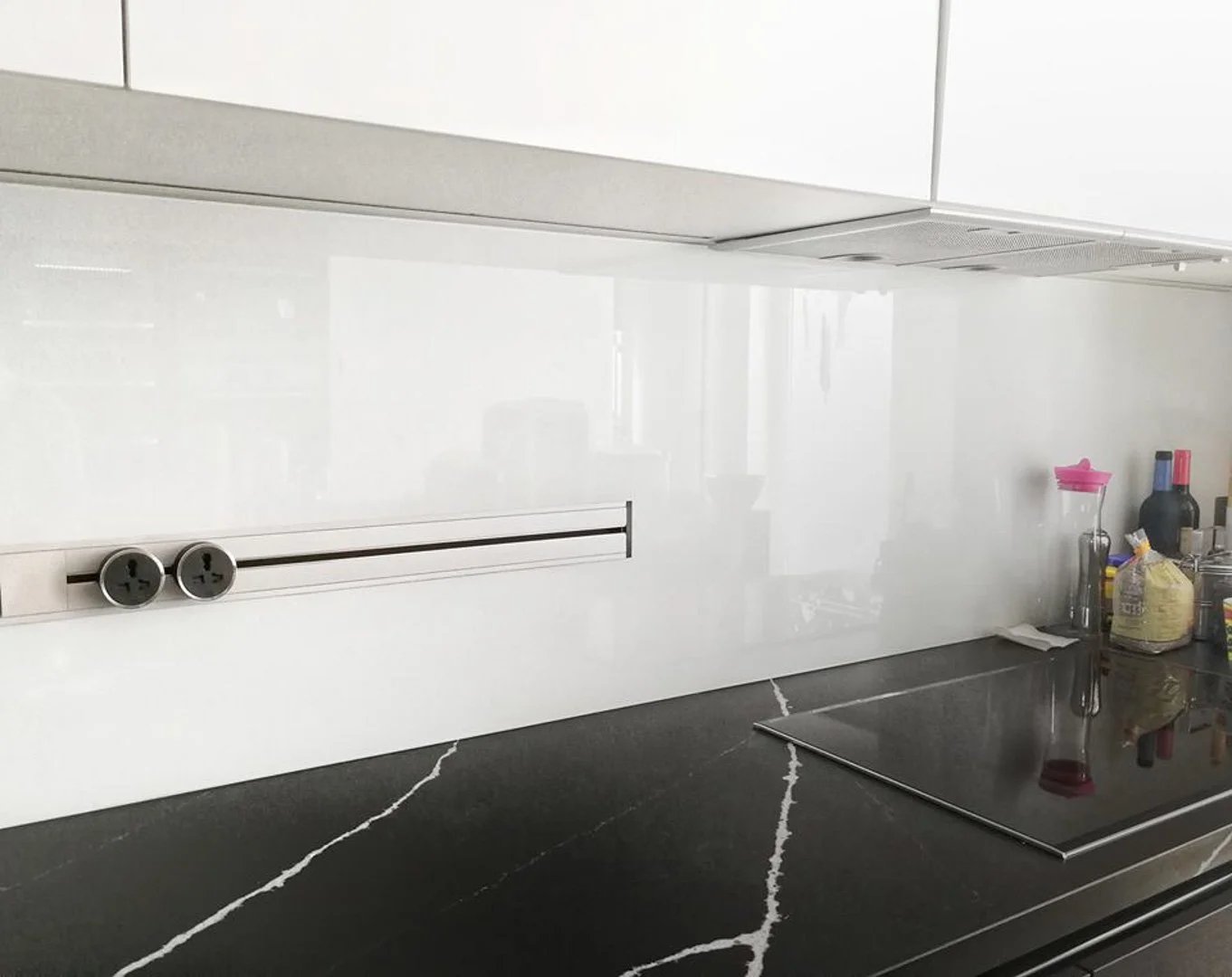 Line8 Model SL track in Pearl White above a kitchen countertop powering appliances