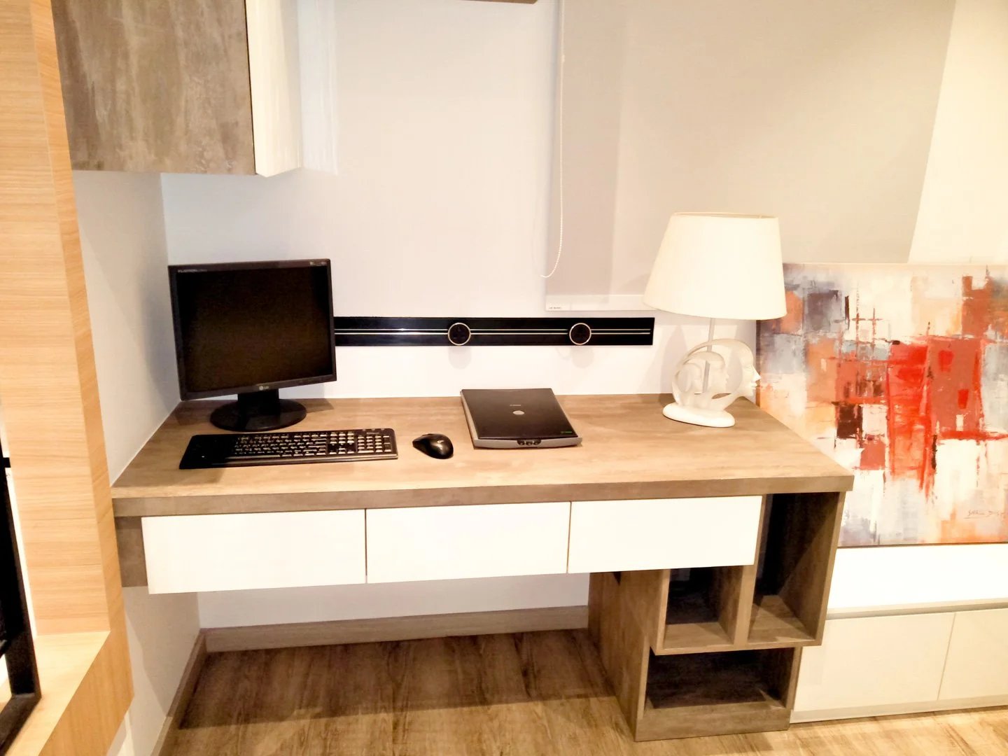 Line8 Model SL track in Black Hairline above a study desk powering a computer and lamp