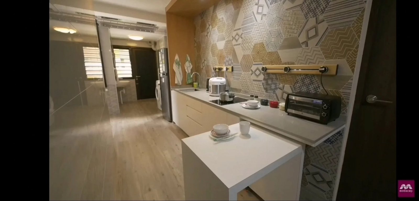 Line8 Model SL track in Black Hairline above a kitchen countertop with appliances and tableware