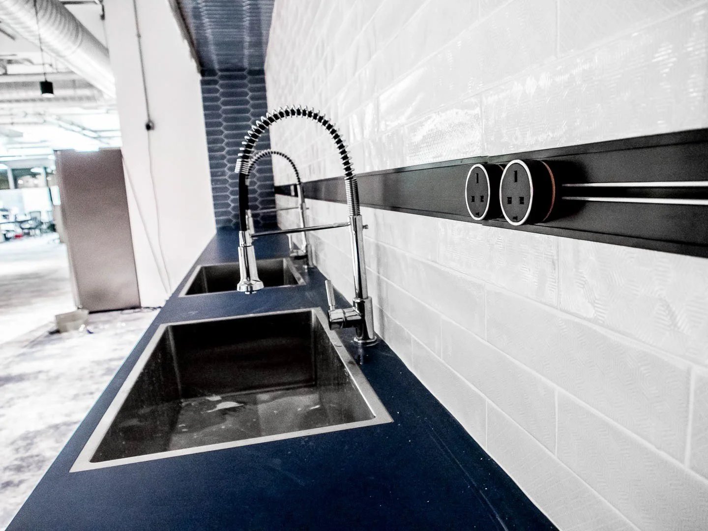 Line8 Model SL track in Black Hairline above a kitchen sink with dual basins